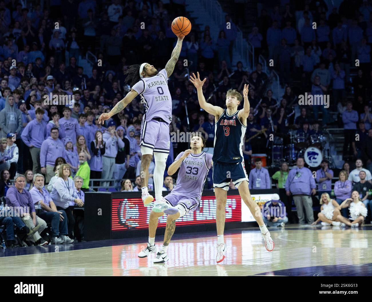 Kansas State's Dug McDaniel, top, steals an inbound pass over Arizona's