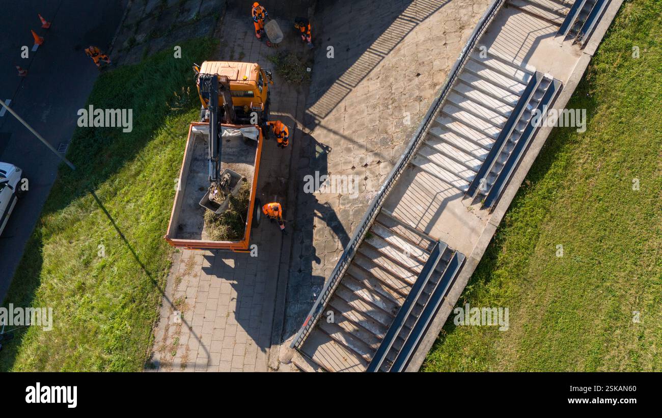 Construction workers in orange uniforms hi-res stock photography and ...