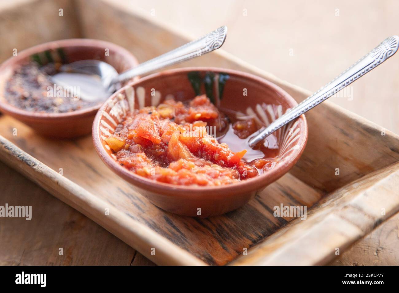 Authentic traditional spicy chili sauce salsa with tomato in a restaurant in Oaxaca, Mexico. Stock Photo