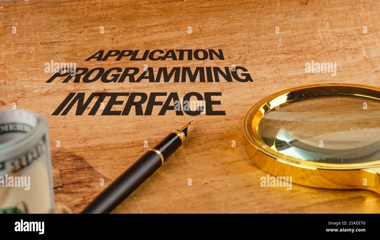 The concept of technology and development. Phrase, words, text APPLICATION PROGRAMMING INTERFACE text API written on paper, front view. Stock Photo