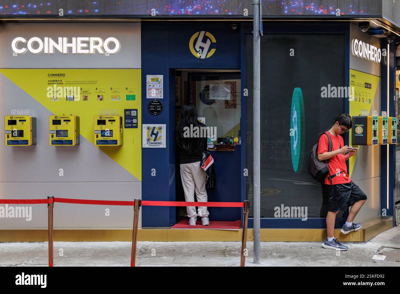 Hong Kong, China. 21st Oct, 2024. People seen outside COINHERO in Hong  Kong. COINHERO is one of the largest Bitcoin ATM networks in Asia. Hong  Kong has confirmed that crypto including ether (