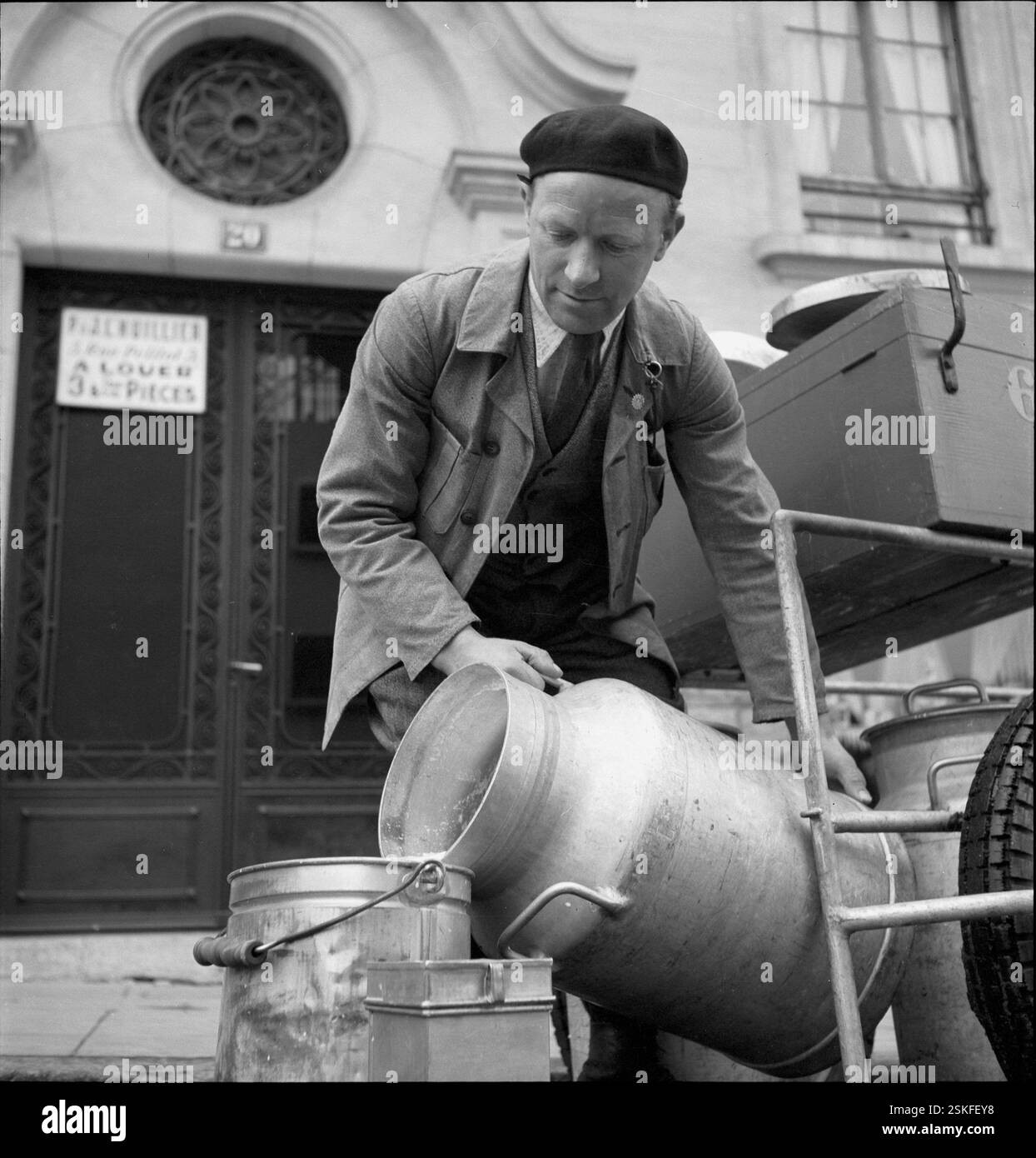 Milkman delivering milk Black and White Stock Photos & Images - Alamy