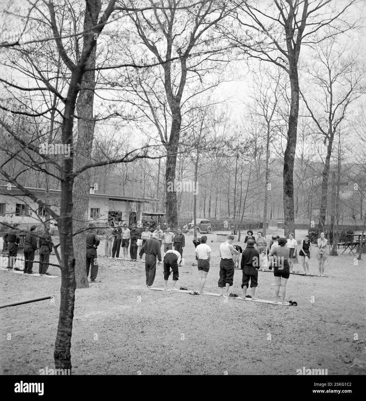 Erwachsene beim Spielen--- Spiel und Spass im Wanderleiterkurs in der Jugendherberge Magliaso, 1940#PLay and fun at course for instructors in hiking at youth hostel in Magliaso, 1940- RDB BY DUKAS Stock Photo