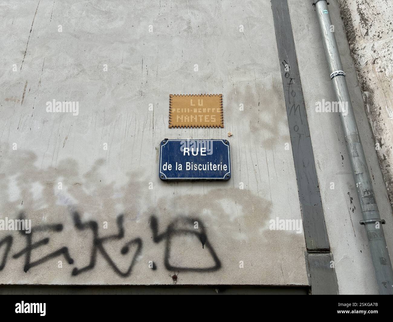 Street sign in Nantes, France. Rue de la Biscuiterie. Famous city landmark - Smartphone Captured Stock Image