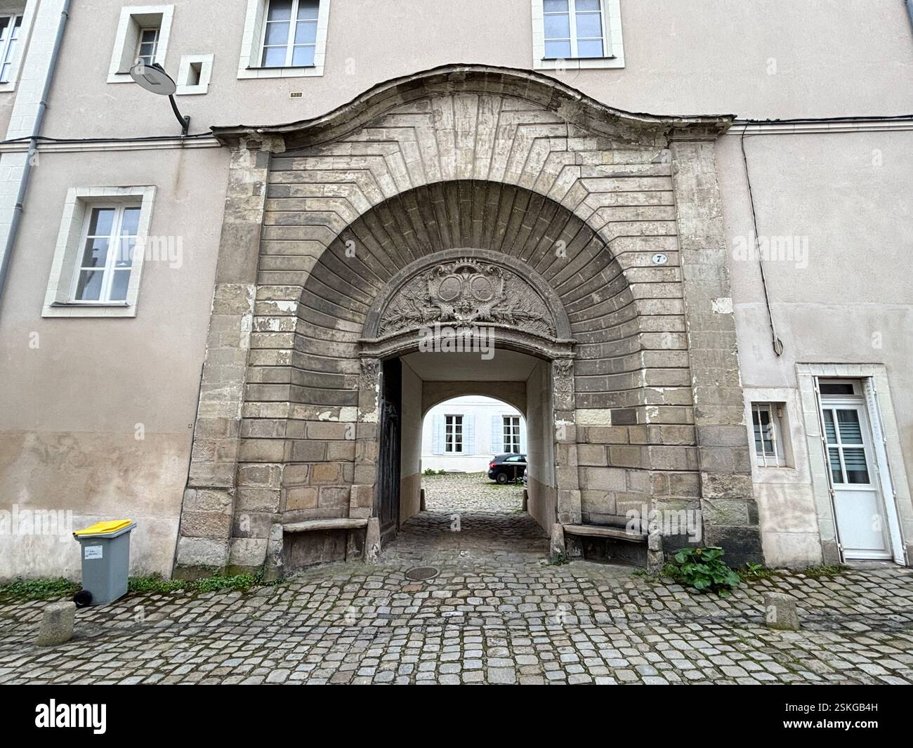 Old stone archway between two buildings in Nantes, France - Smartphone Captured Stock Image
