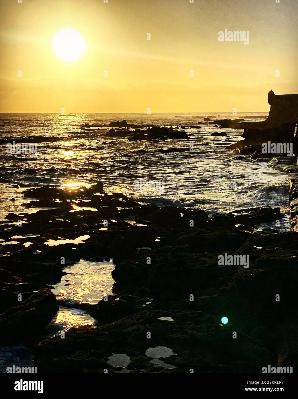 Sunset in San Sebastian fortress in La Caleta beach in Cadiz, Andalucia, Spain. - Smartphone Captured Stock Image