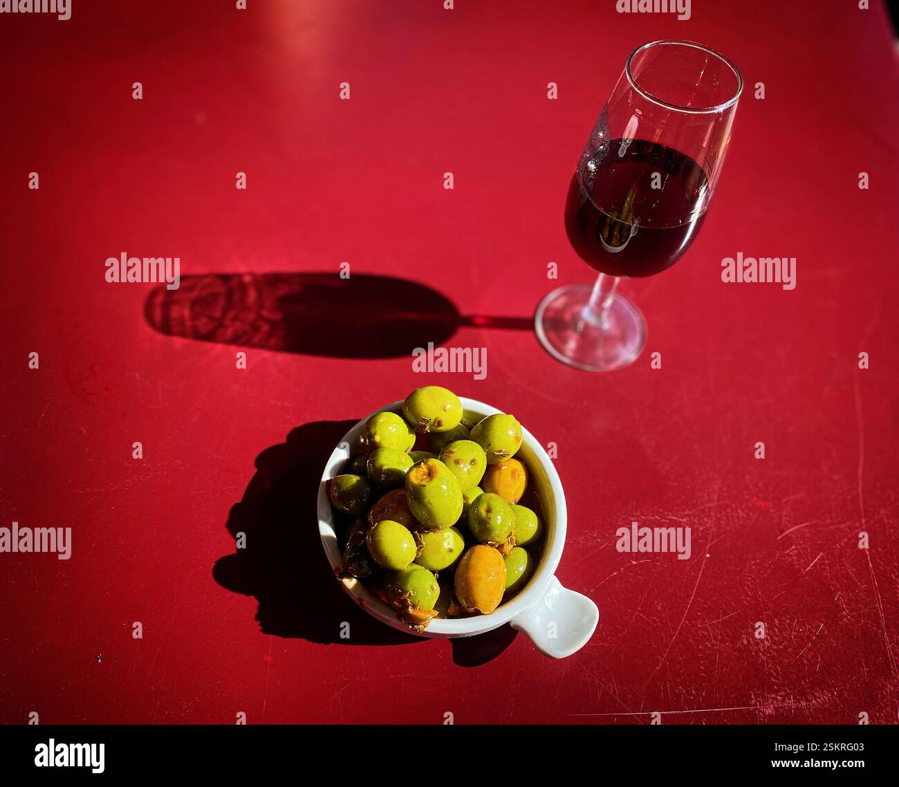 Green olives and a cup of Solera 1847 wine in Jerez de la Frontera, Cadiz province, Andalusia, Spain - Smartphone Captured Stock Image