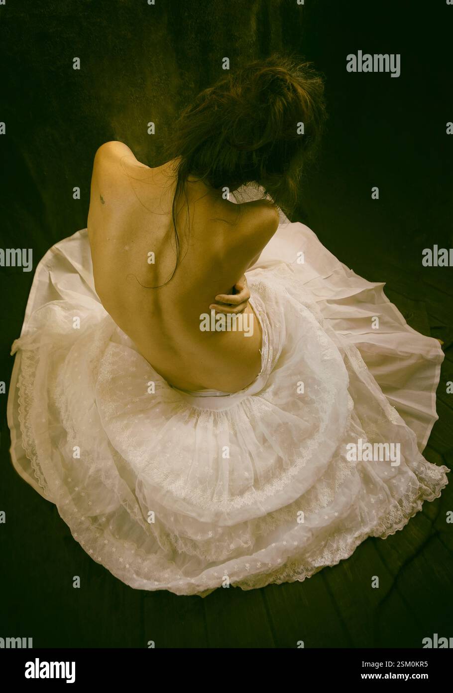 woman in organza skirt sitting on the floor 2, spain Stock Photo