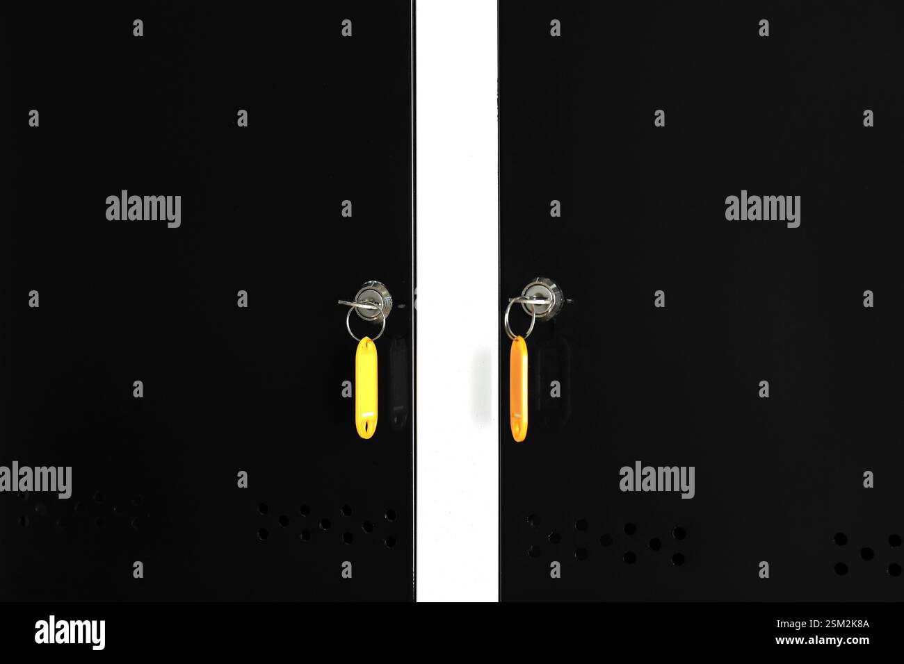 Modern lockers with bright keys, closeup view Stock Photo