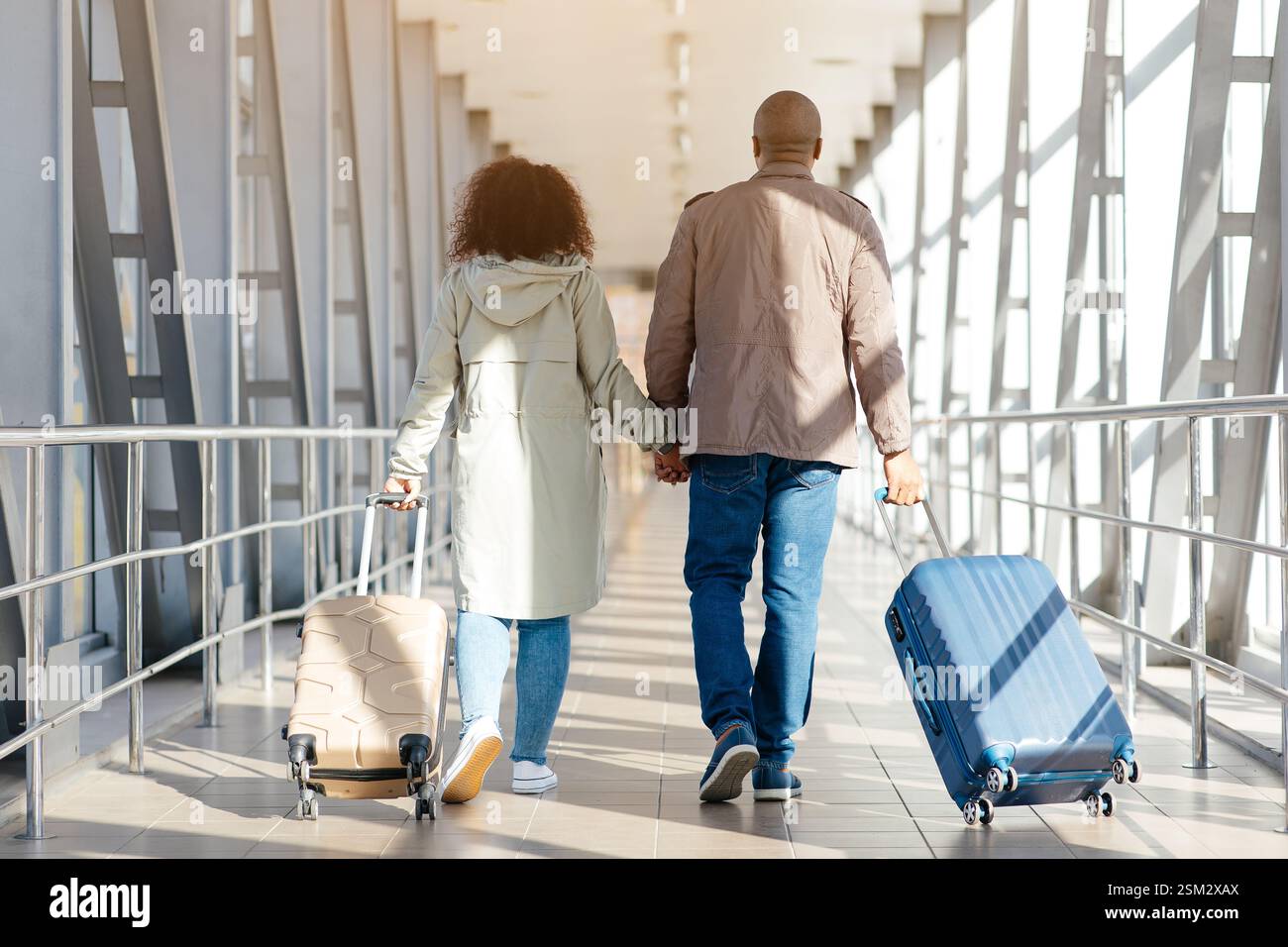 Romantic African Couple Walking With Suitcases In Airport Terminal ...