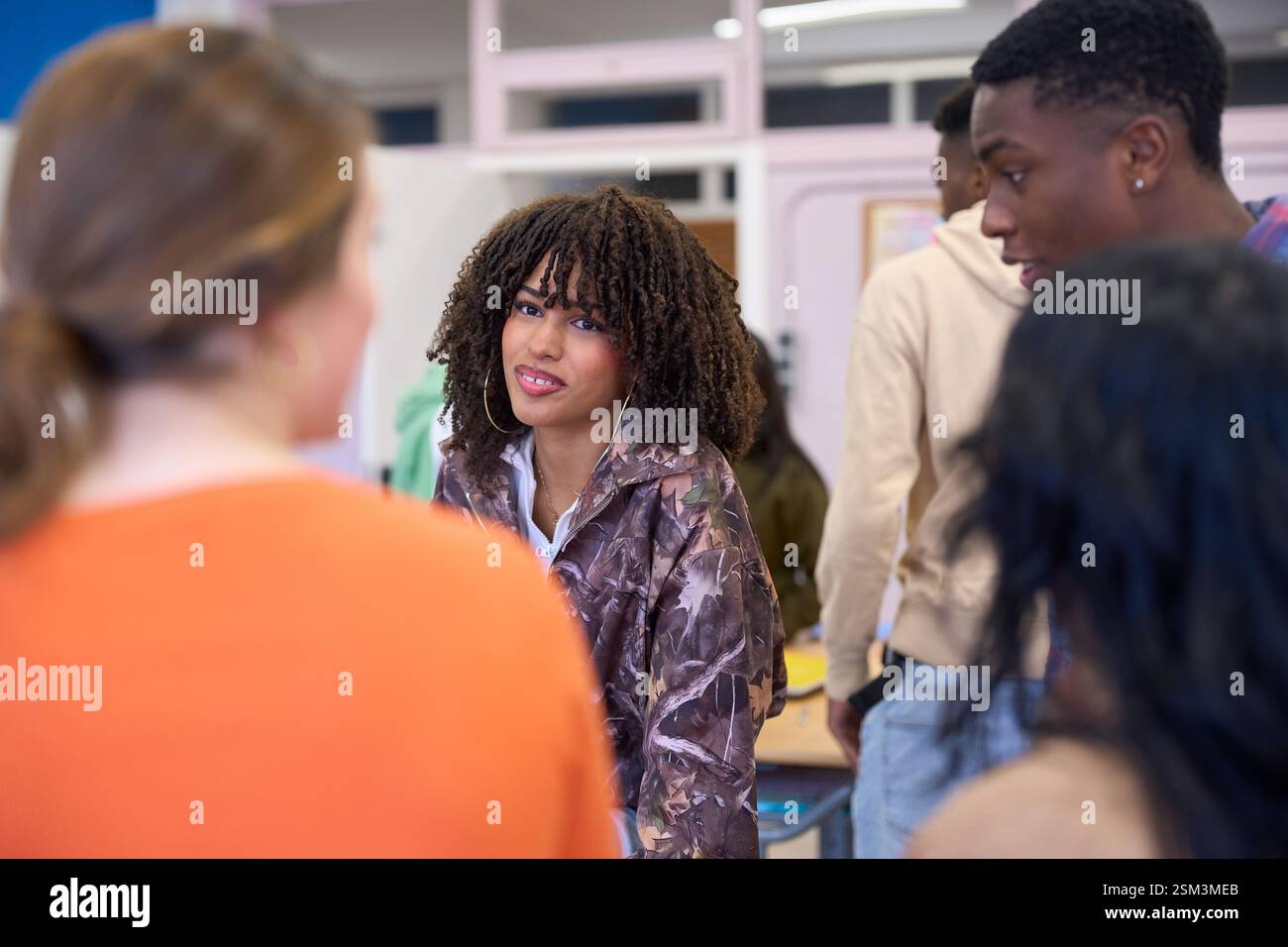 Students chatting and learning together at their institute Stock Photo