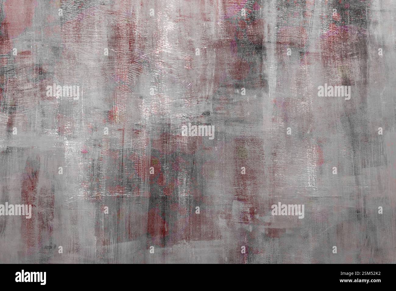Abstract texture featuring muted tones with subtle red and gray hues ...