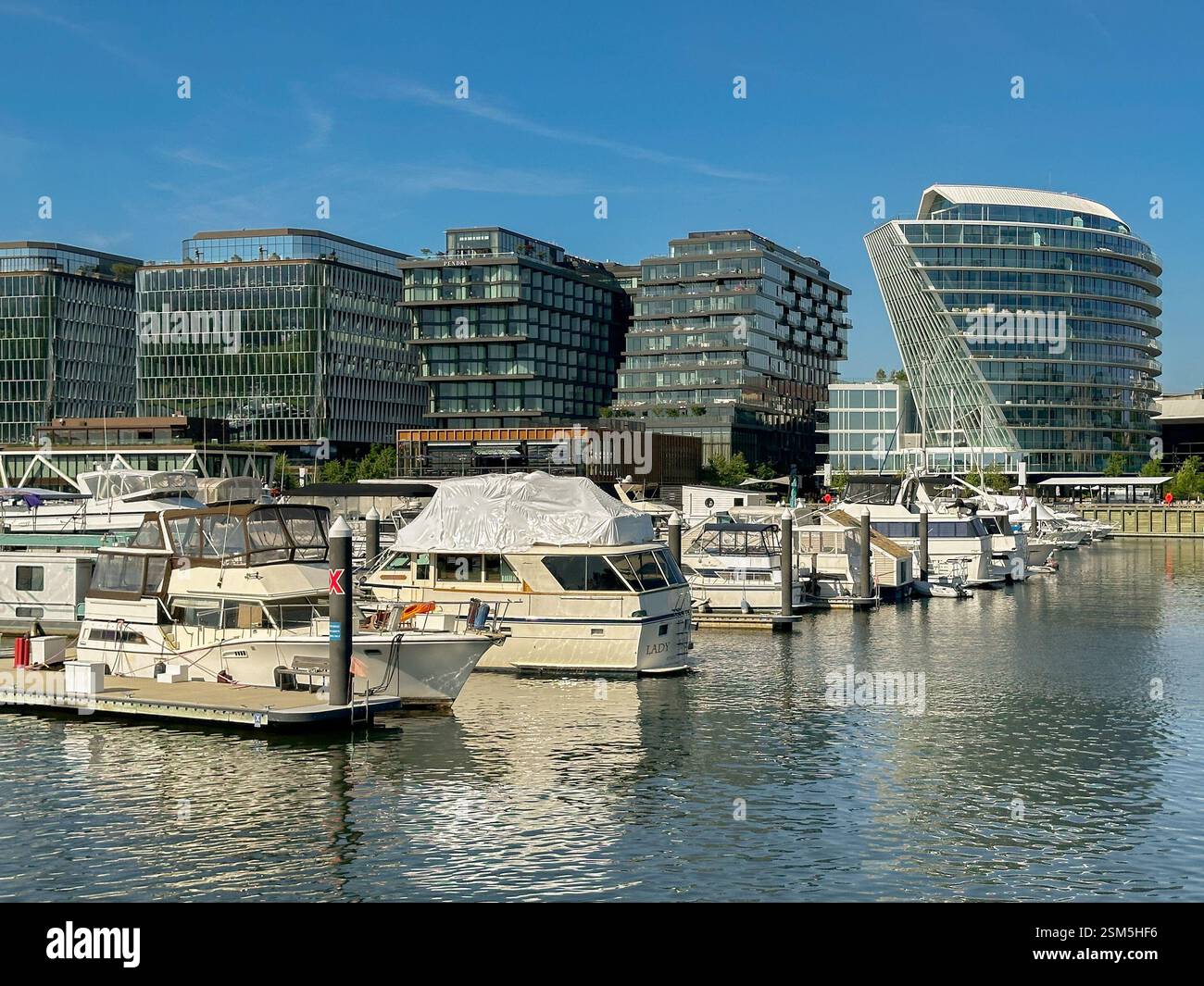Washington DC, USA - 3 May 2024: Motorboats moored in the marina at the Wharf development on the Potomac River in Washington DC. - Smartphone Captured Stock Image