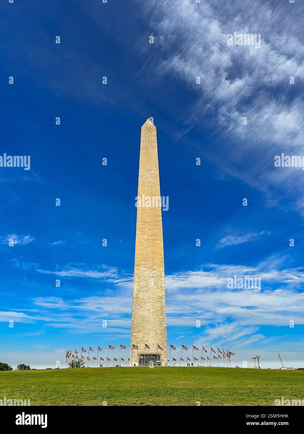 Washington DC, USA - 30 May 2024: Scenic landscape view of the Washington Monument in Washington DC with a dramatic blue sky - Smartphone Captured Stock Image