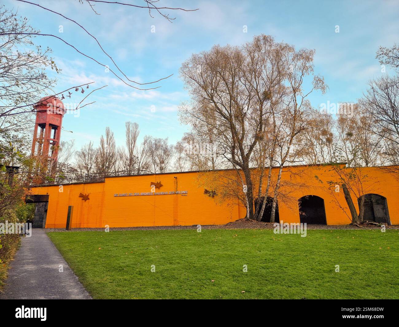 Entrance of the Nature Park Schöneberger Südgelände on the former Tempelhof railway yard in Berlin, Germany; Railway Technology & Industrial Culture - Smartphone Captured Stock Image