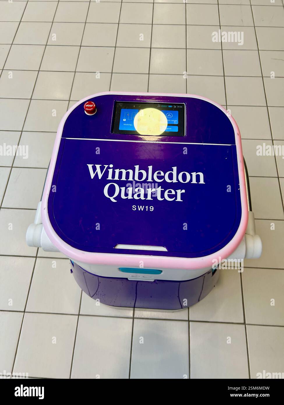Robot floor cleaner operating at Wimbledon Quarter (formerly Centre Court) mall in London - Smartphone Captured Stock Image