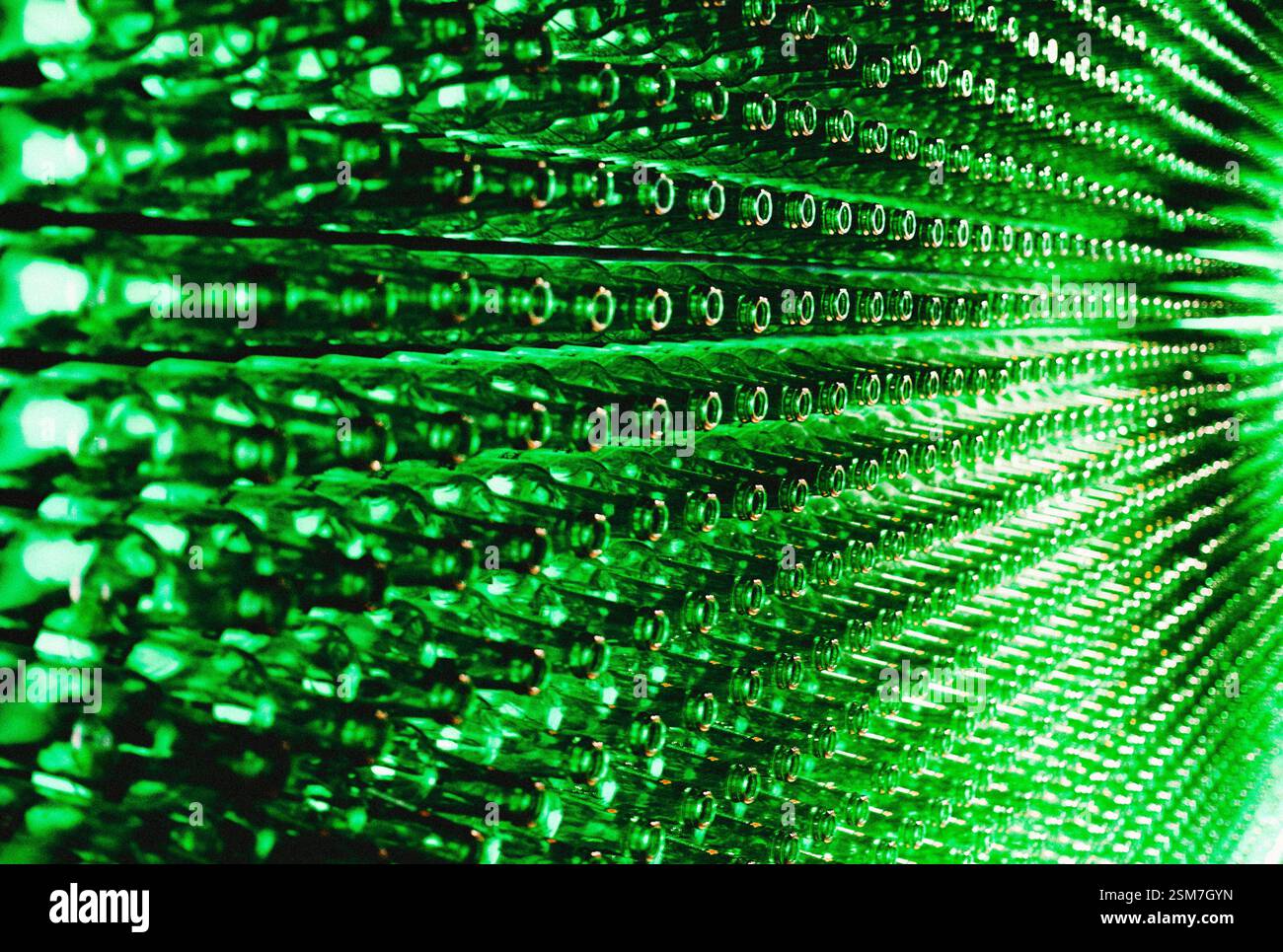 a wall made of empty heineken bottles Stock Photo