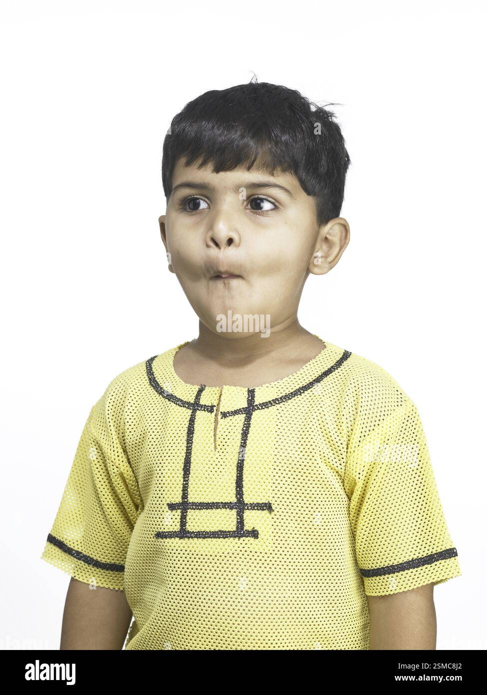 South Asian Indian boy making funny face in nursery school MR Stock ...