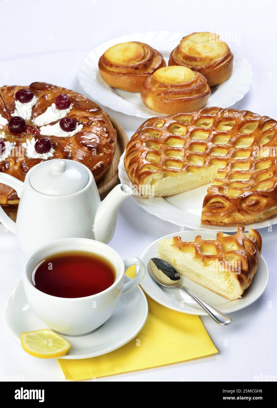 Still life of setout table with baking pies ant tee cup and pot. Image ...