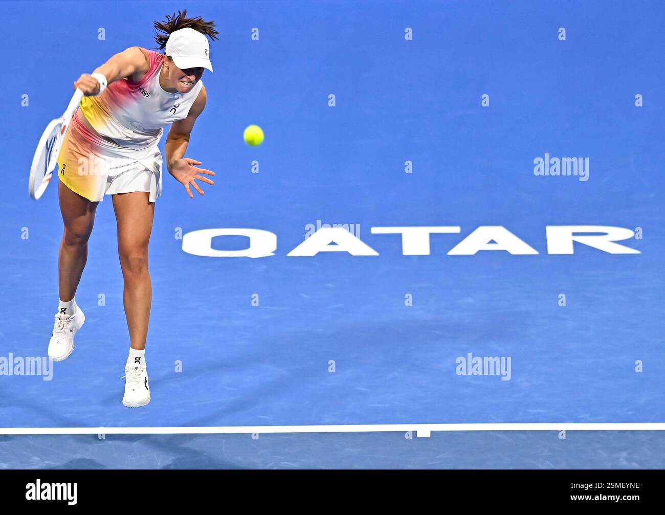 Doha, Qatar. 12th Feb, 2025. Iga Swiatek of Poland serves during women