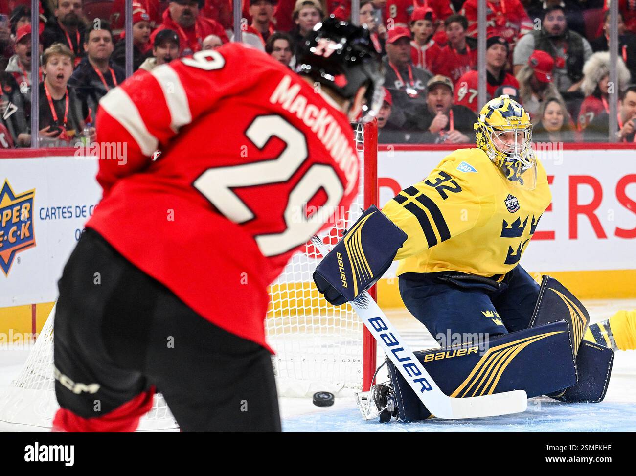 Canada's Nathan MacKinnon (29) scores against Sweden goaltender Filip