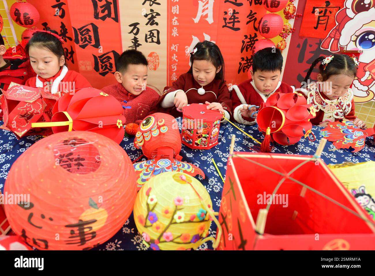 Children learn to make lanterns to welcome the Lantern Festival in ...