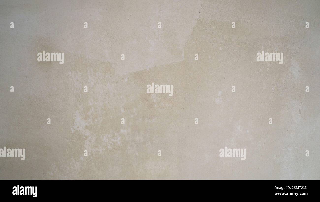Picture of Soft light gradually revealing intricate texture of beige concrete wall ...