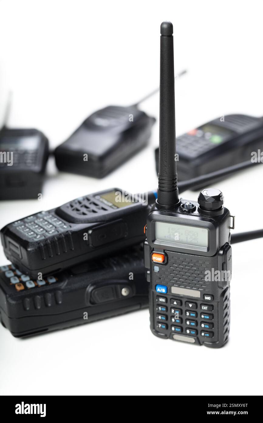 Modern communication tools on display with various handheld radios in ...