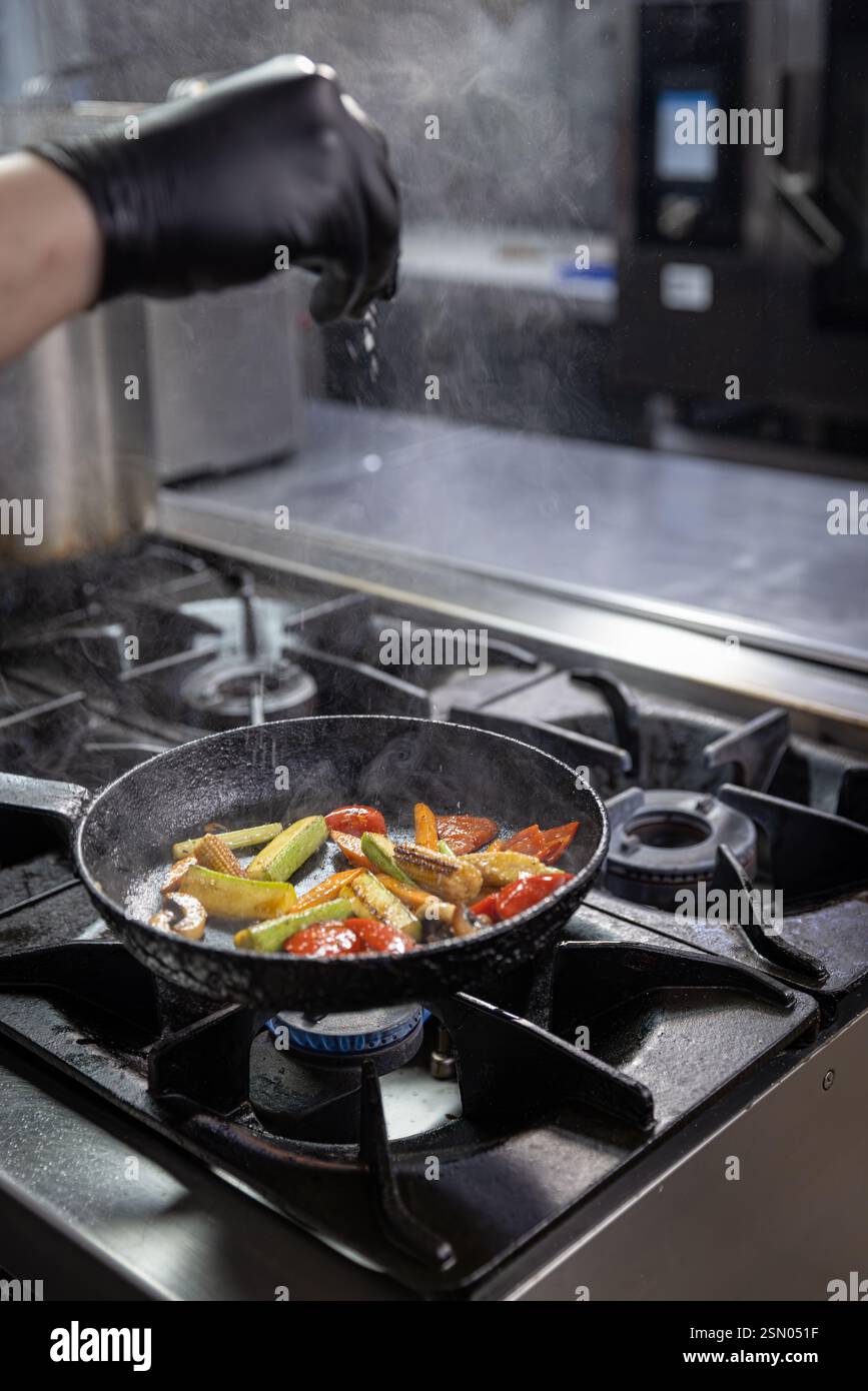 Chef adding spices grilled hi-res stock photography and images - Alamy