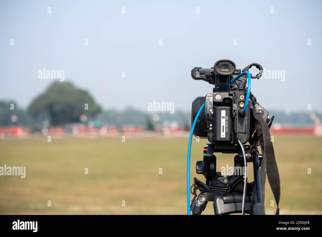 Professional Video camera on tripod to record a event Stock Photo