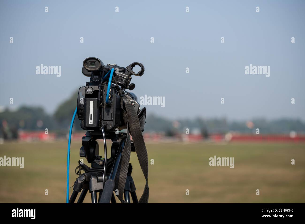 Professional Video camera on tripod to record a event Stock Photo