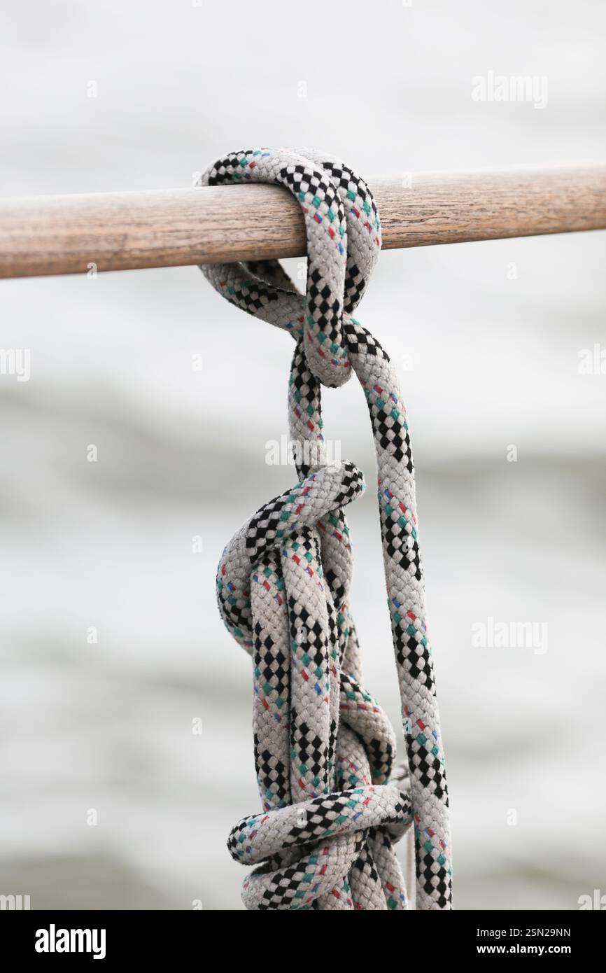 Rope on a ship on a railing Stock Photo - Alamy
