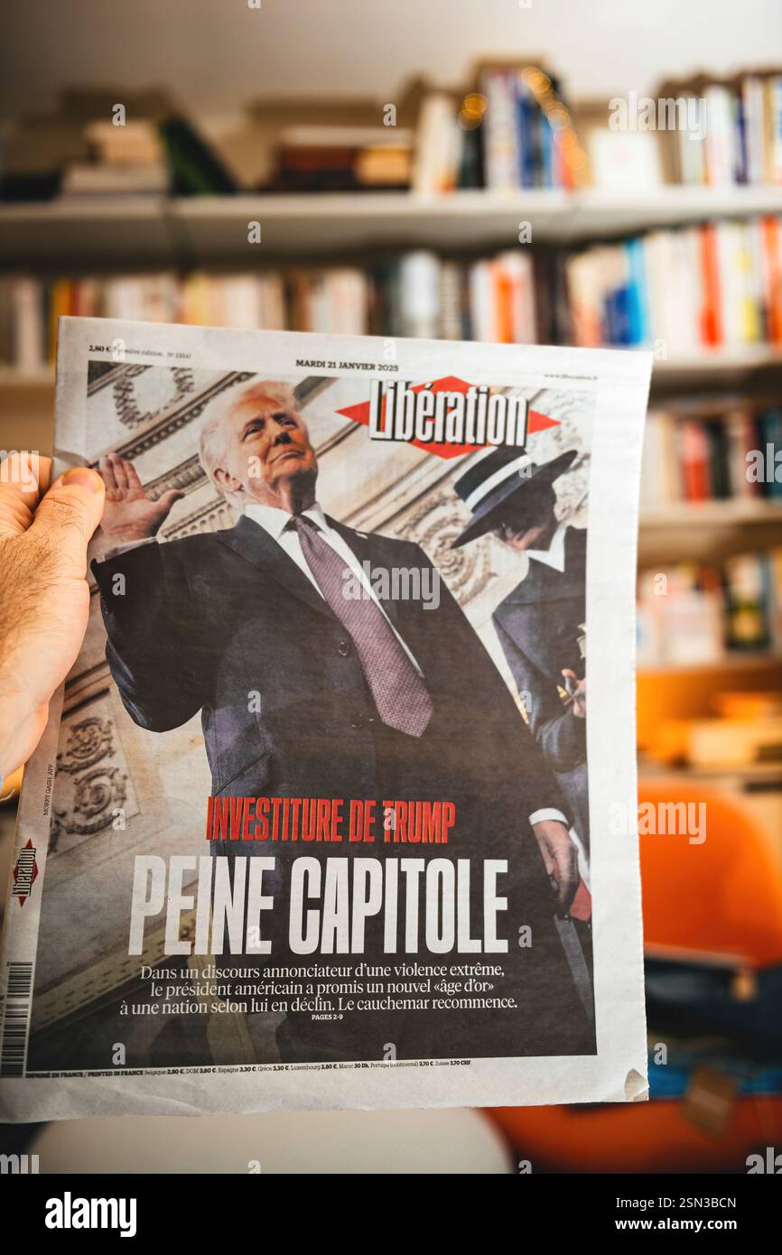 Paris, France Jan 21, 2025 A hand holds a Liberation newspaper with