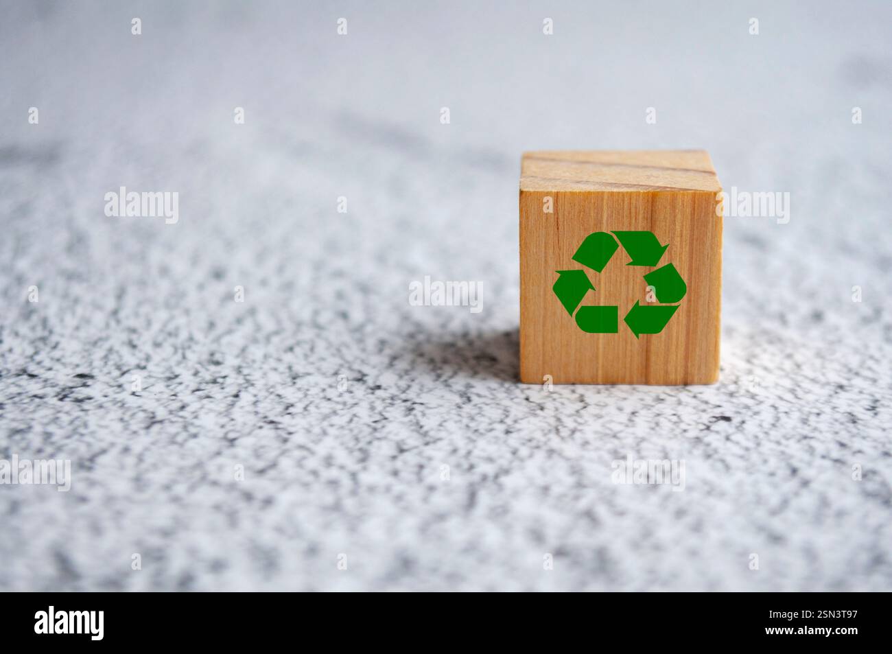 Isolated recycle symbol on white marble. Recycling concept Stock Photo