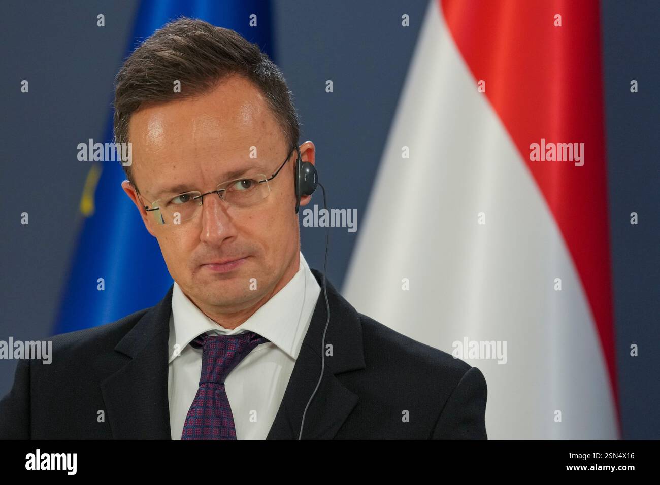 Hungarian Foreign Minister Peter Szijjarto listens his Serbian