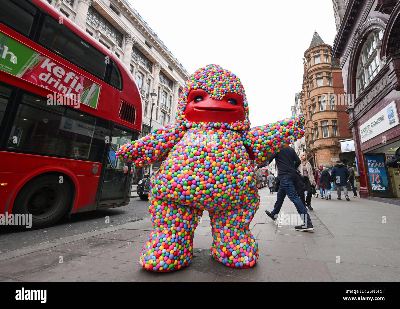 EDITORIAL USE ONLY The 'Gummy Monster' mascot hands out samples of