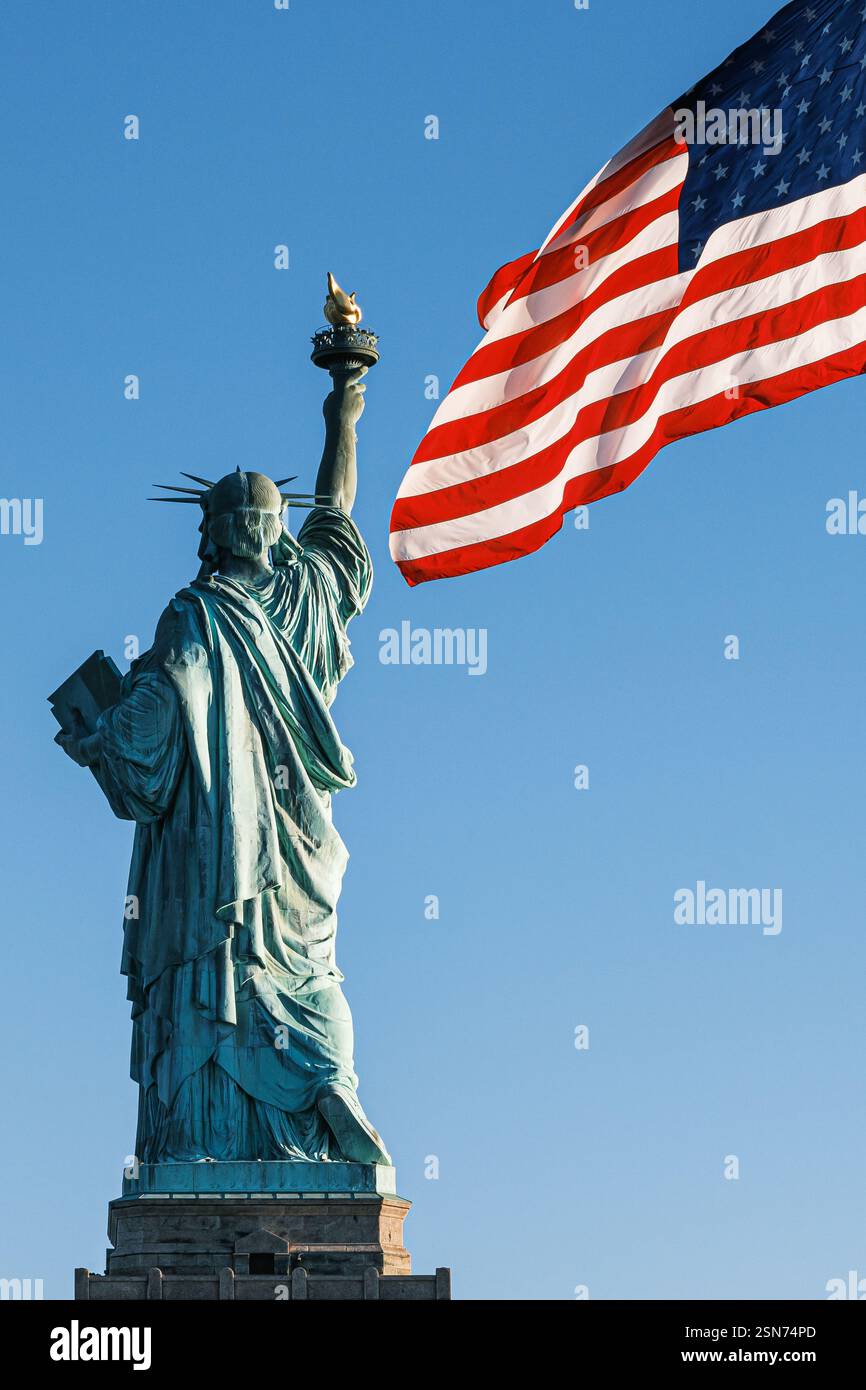 A close-up of the Statue of Liberty, exuding vibrant American flag patriotism from the base of Liberty Island, New York City. Stock Photo