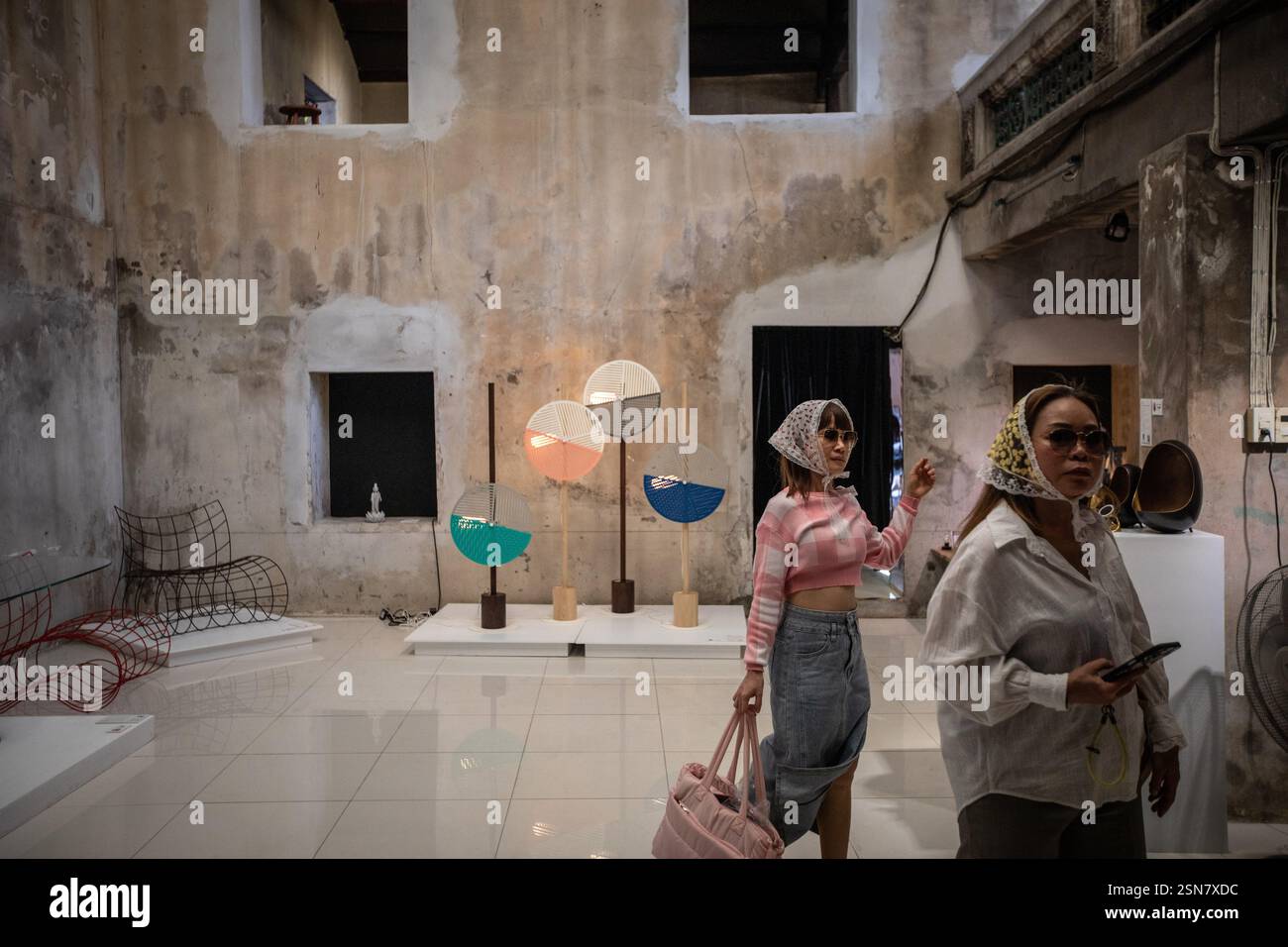 People enjoy the exhibition during Bangkok Design Week 2025. Bangkok ...