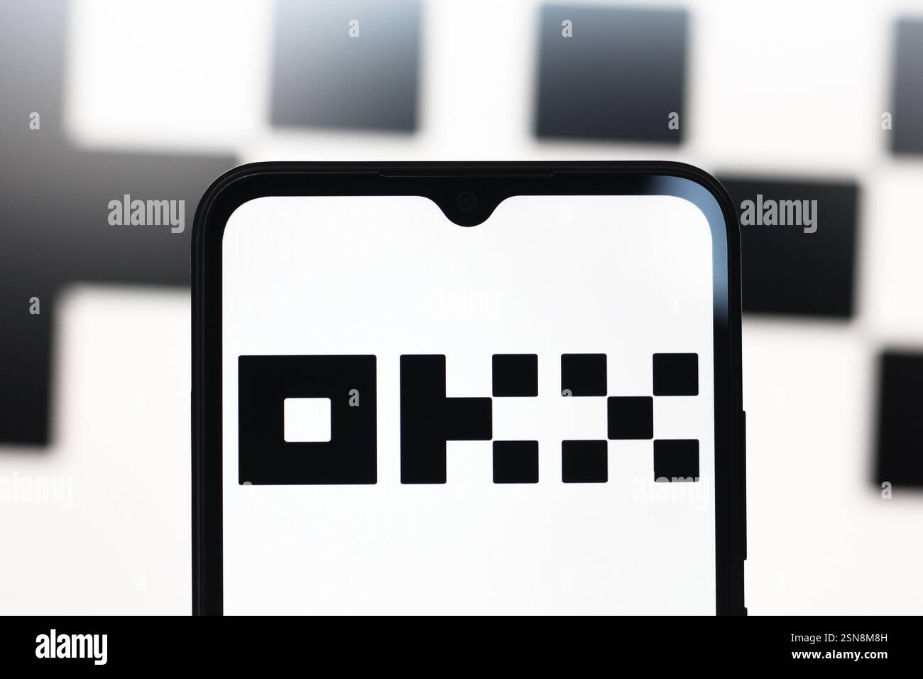 In this photo illustration, the OKX logo is seen displayed on a smartphone screen. Stock Photo