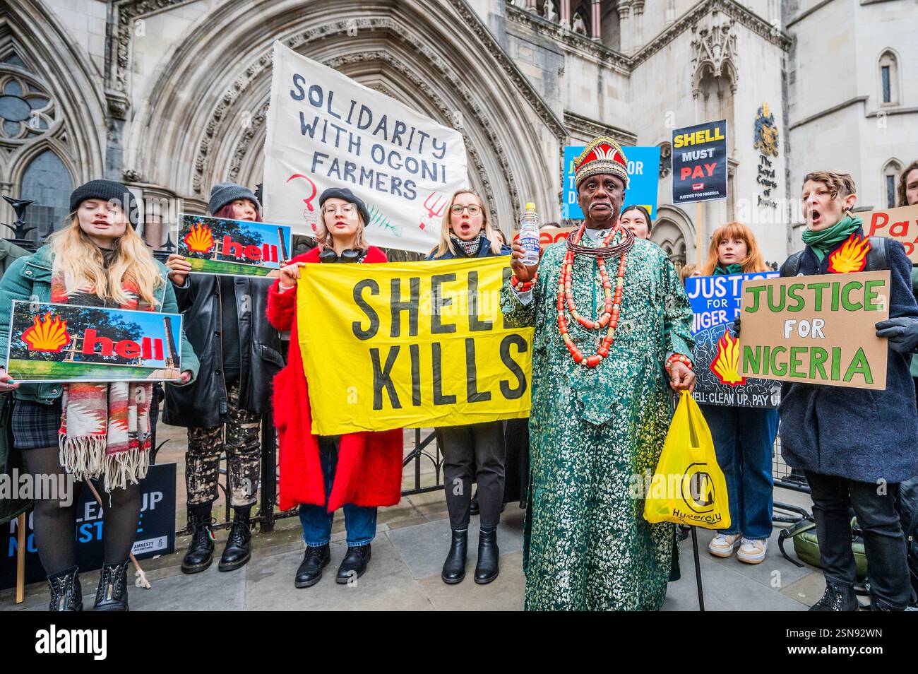 London, UK. 13th Feb, 2025. HRH King Emere Godwin Okpabi joins the protest - A solidarity demonstration, at the High Court, on the first day of the major court hearing in which over 13,000 people from the Niger Delta's Bille & Ogale communities will be holding Shell accountable and telling them to: Clean Up and Pay Up! Hosted by Justice for the Niger Delta, Fossil Free London, Amnesty International and many more. Credit: Guy Bell/Alamy Live News Stock Photo