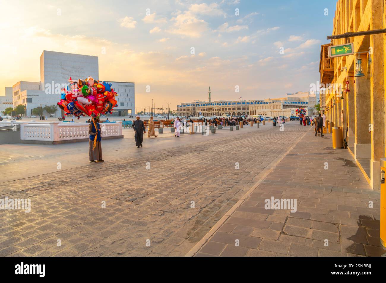 The sun sets over the historic Souq Waqif market in the historic center of Doha Qatar. Stock Photo