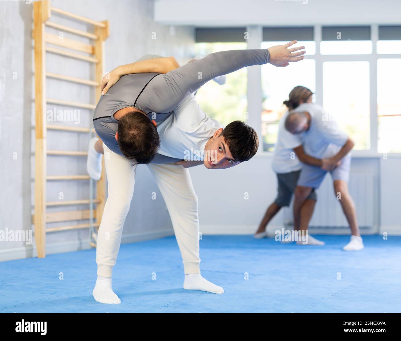 Two men training judo technique in studio Stock Photo - Alamy