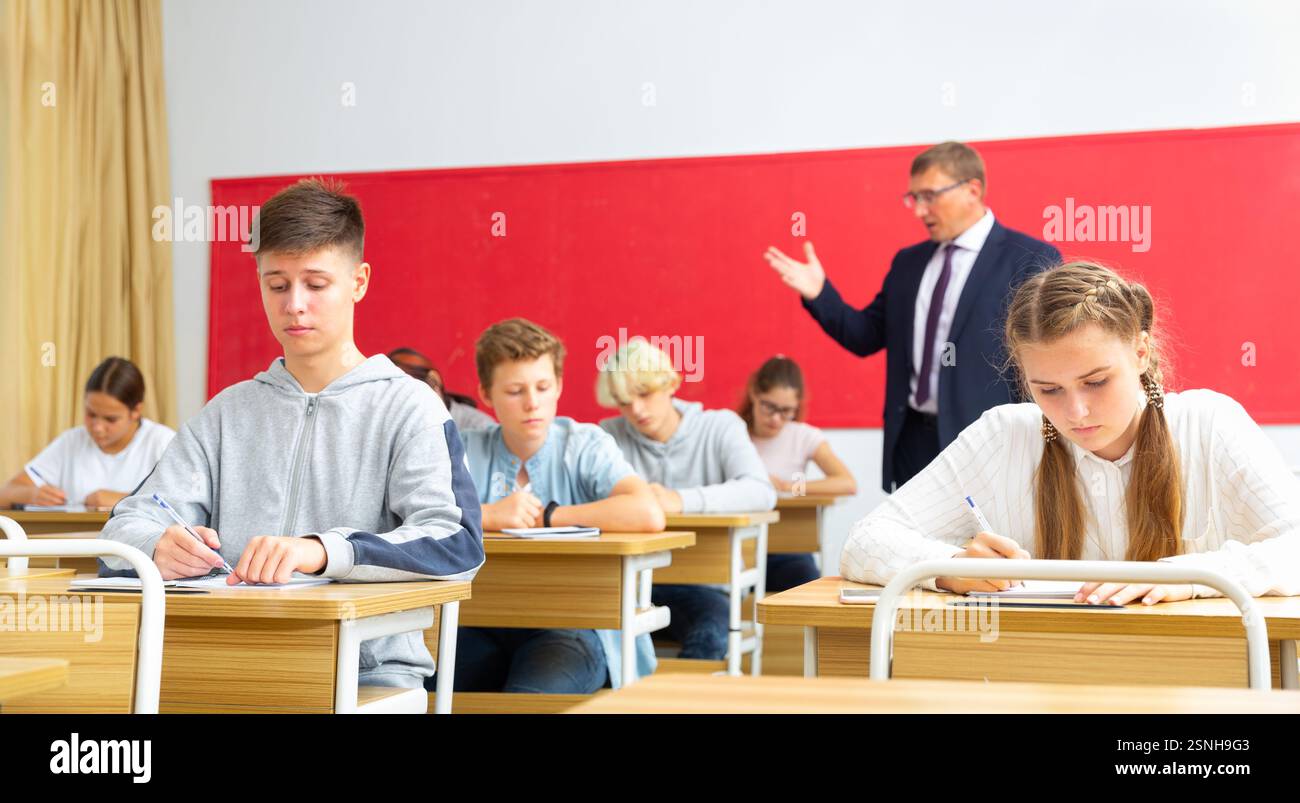 Teacher communicates freely with students in classroom at school Stock ...