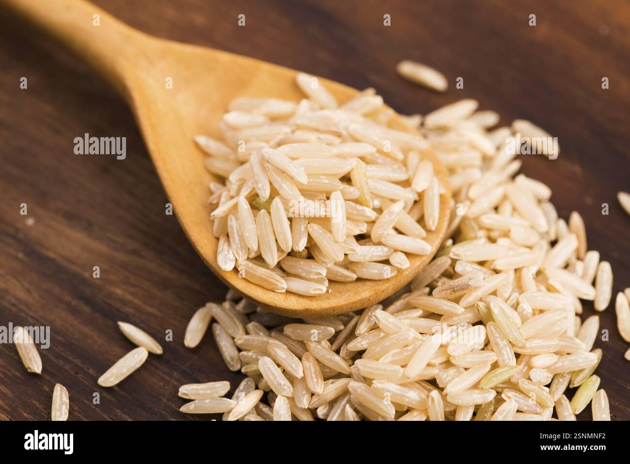 Spoon brown rice close hi-res stock photography and images - Alamy