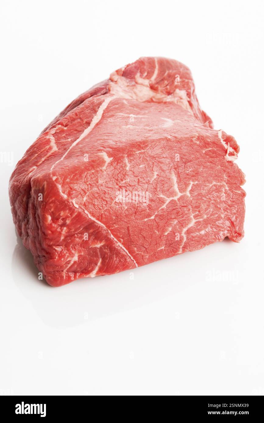 Raw beef isolated on white background Stock Photo - Alamy