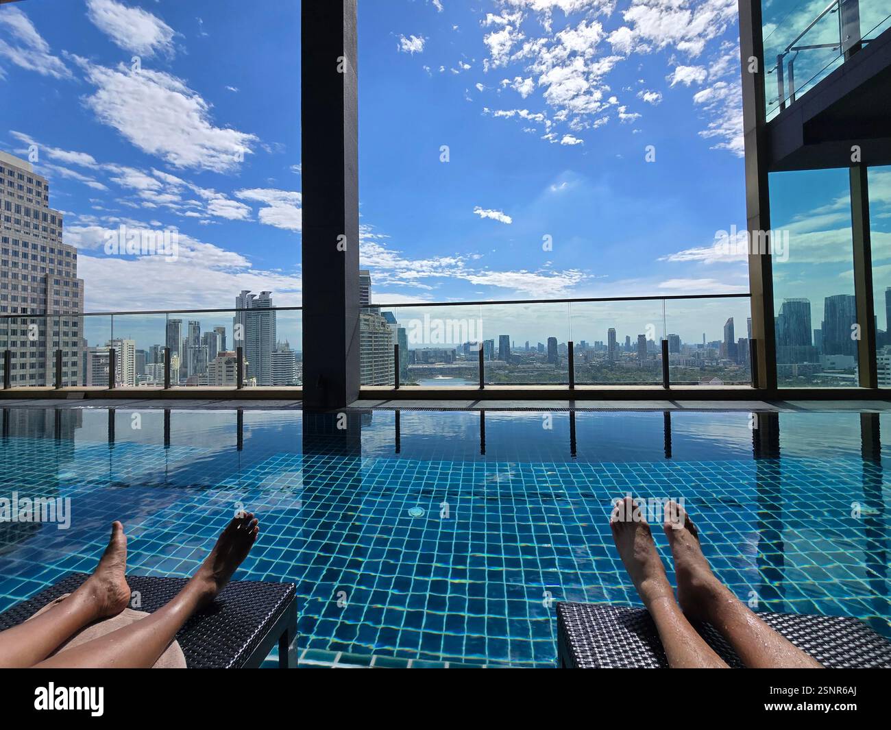 The rooftop swimming pool at the Solaria Nishitetsu hotel on Sukhumvit Road in Bangkok, Thailand. - Smartphone Captured Stock Image