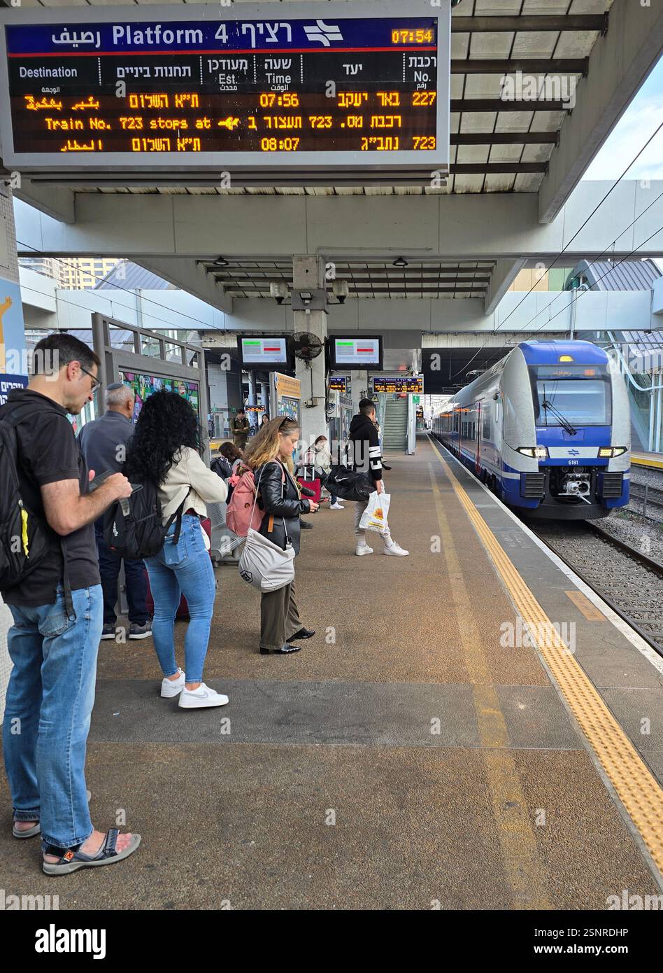 Passengers waiting for the train on the platform at the Savidor railway station in Tel-Aviv, Israel. - Smartphone Captured Stock Image