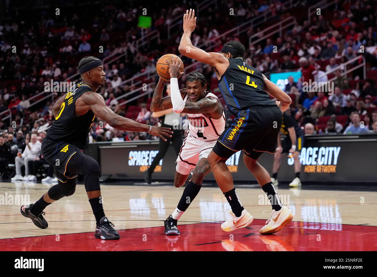 Jimmy Butler Guarding Houston Rockets' Jalen Green, center, drives between Golden State ...