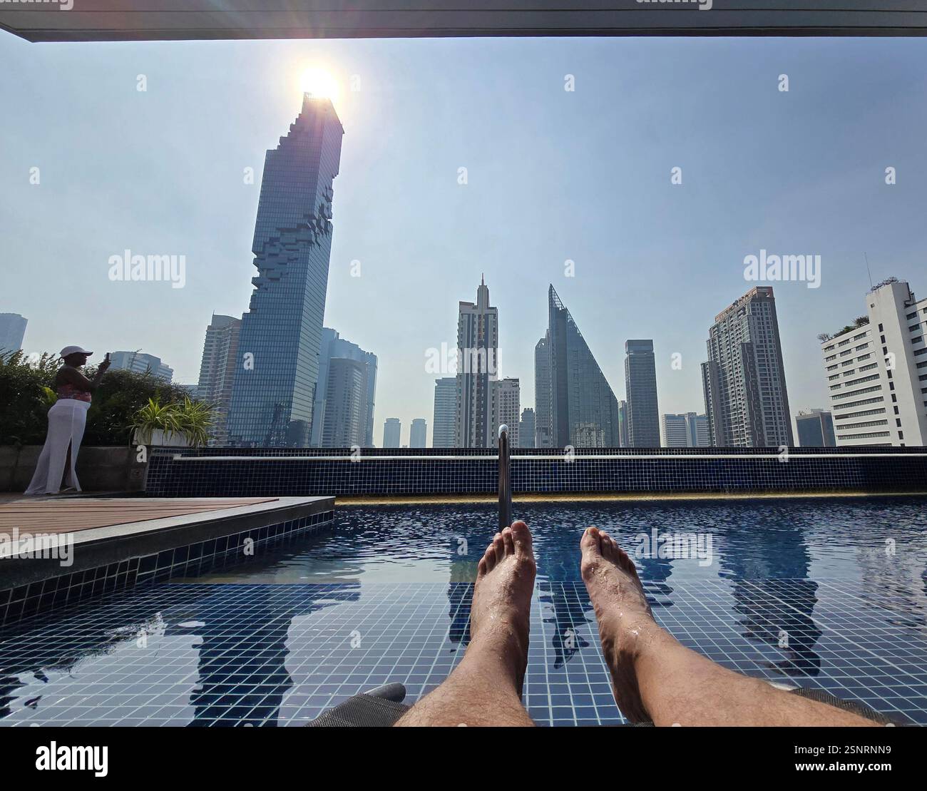 The rooftop swimming pool at the Pullman hotel on Si Lom Road in Bangkok, Thailand. - Smartphone Captured Stock Image