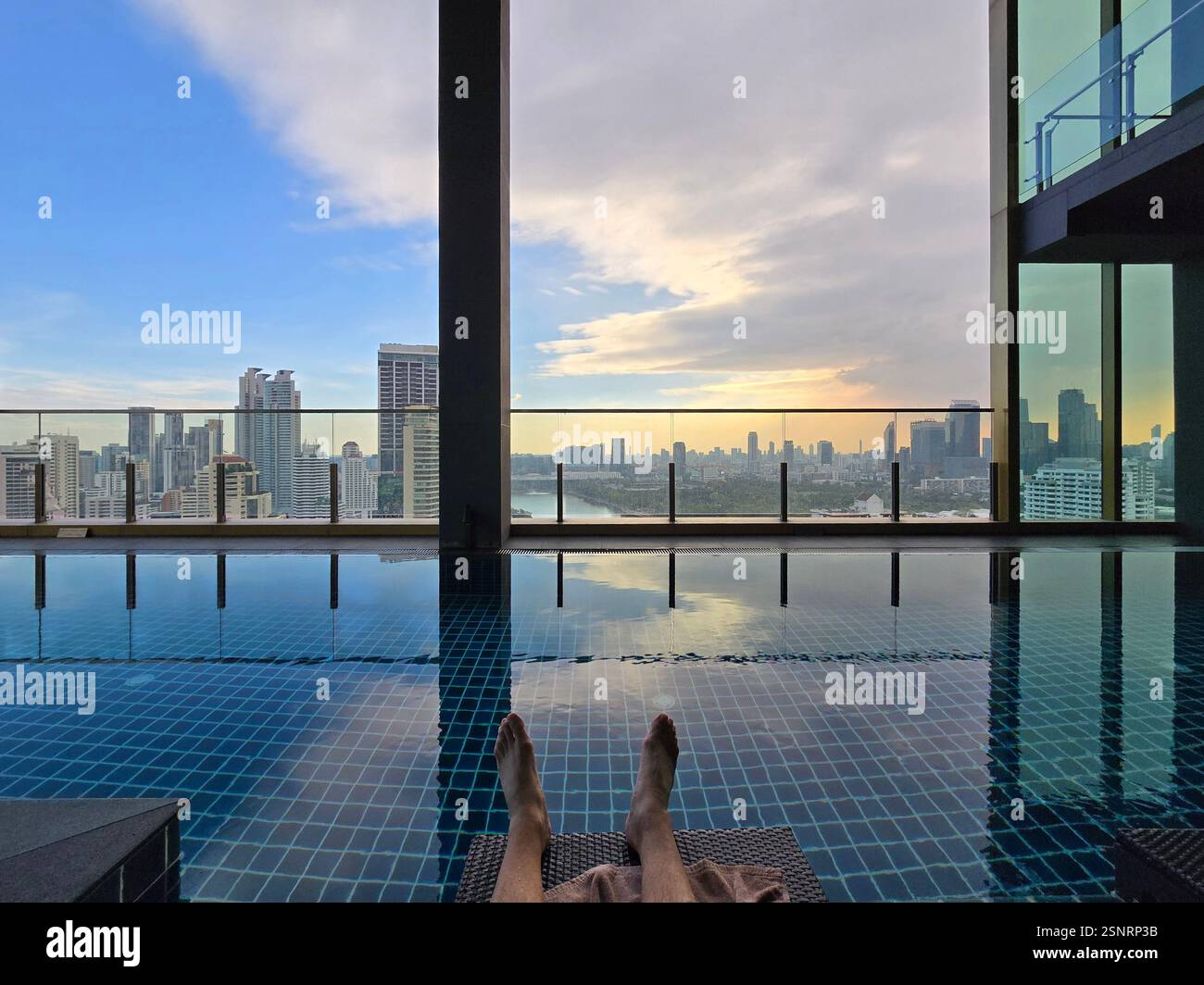 The rooftop swimming pool at the Solaria Nishitetsu hotel on Sukhumvit Road in Bangkok, Thailand. - Smartphone Captured Stock Image